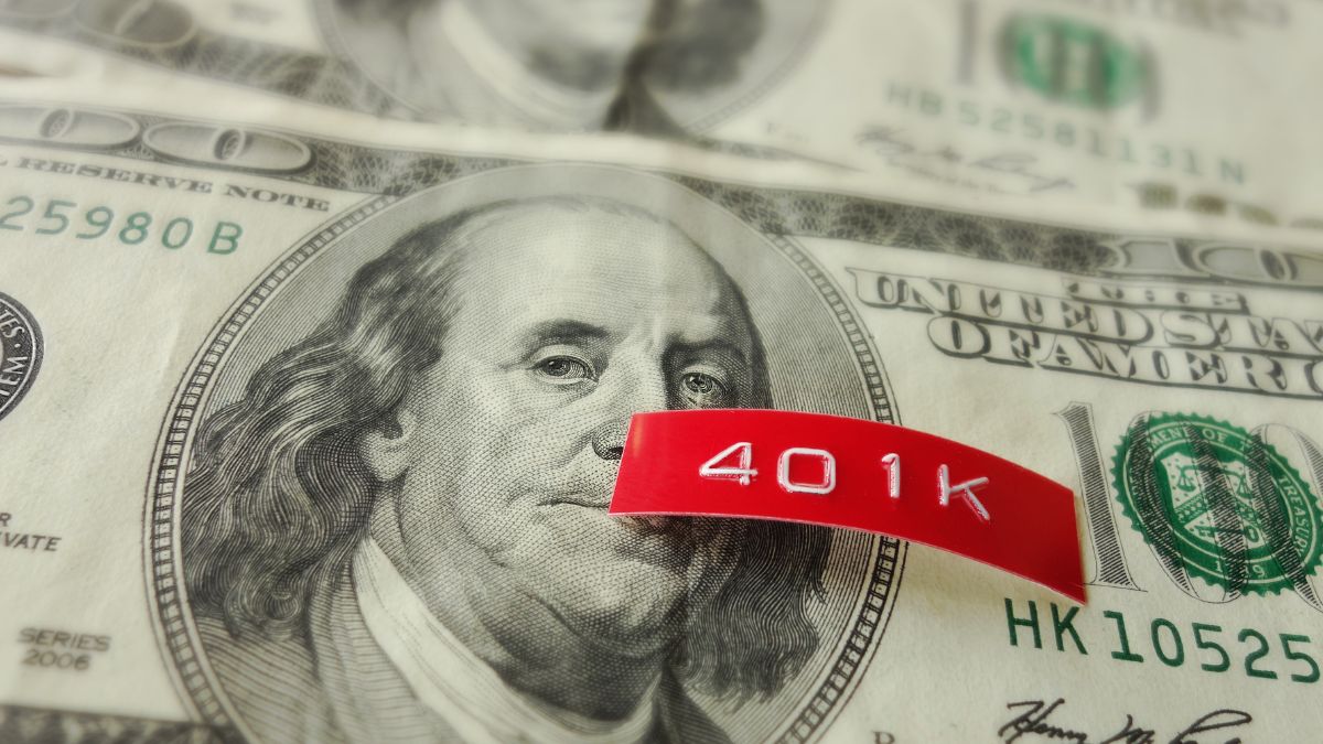 A red label printed 401K on top of a hundred dollar bill