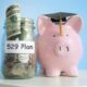 A pink piggy bank wearing a graduation cap next to a money jar with 529 plan text on it
